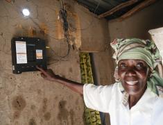 Tanzania woman points at meter